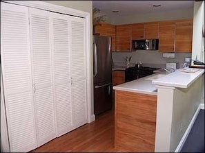 Kitchen with dishwasher and washer/dryer.  