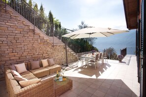 Relax on your private terrace here at "Residence Sala Comacina" apartment n.3