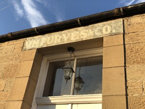 Old Tailor's business sign above the front door