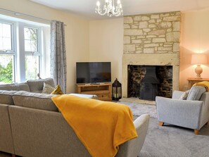 Cosy living room with open fire | Sheilas Cottage, Christon bank, near Alnwick