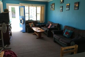 Looking back across lounge to entrance hallway - Bright and cheerful