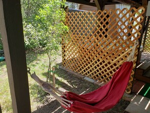 Relax (or take a nap) in the outside hammock