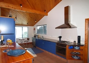 Kitchen with sheltered barbecue deck