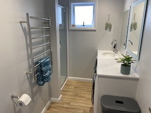 Bathroom: Complete with shower, toilet, vanity and front loader washing machine