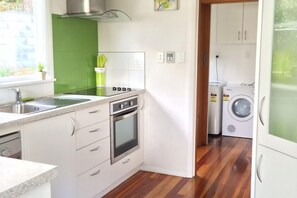 Kitchen with view to full Laundry