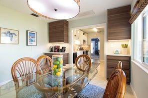 Dining table between the kitchen and back living area