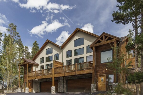 Exterior view of the home from the driveway with 2-car heated garage.