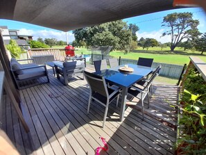 Outside dining with golf course views.