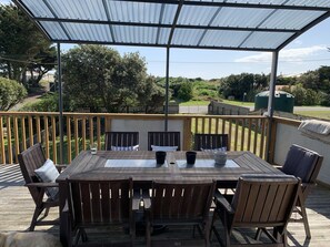 Sunny and sheltered front deck looking towards beach access