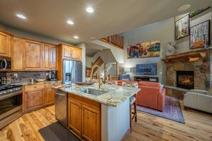 Updated open kitchen flows into the main living area