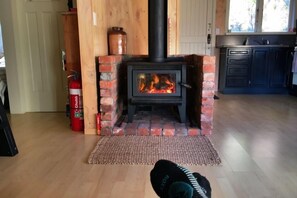 Feet up in front of the fire