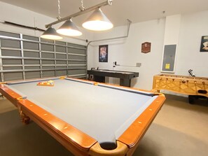 Enjoy endless fun in the game room, complete with a full-sized pool table and cozy seating.