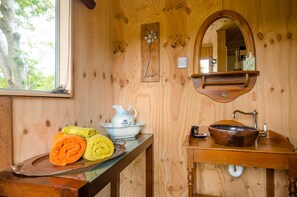 Bathroom/Shower. No power or heating. Gas hot water. Light. 30mtrs from bedroom.