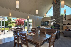Dining and lounge areas open up to outdoor entertaining.