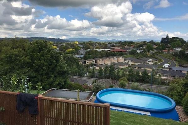 Backyard Pool and trampoline