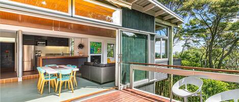 Dining area opening onto deck