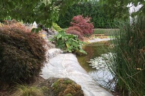 Relax on the rock seat by the pond