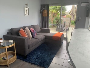 View from kitchenette to outdoor seating area
