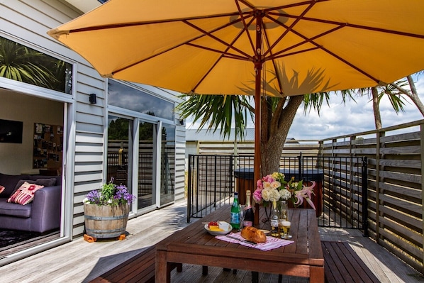 Welcome to Ti Kouka House, outdoor living & dining on a large sunny private deck