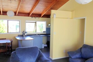 Open-plan, high ceiling living area