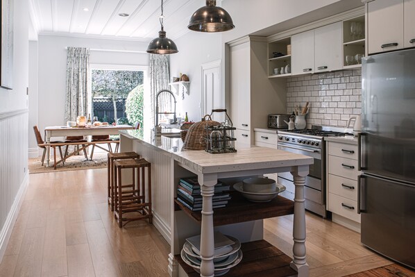 View from sitting area at the end of kitchen/dining area.  