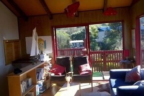 Part of living room. Showing back deck