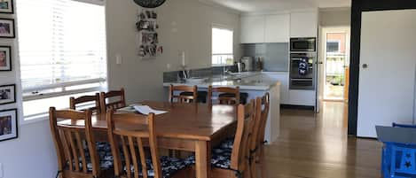 Main kitchen/dining area, opening onto deck 