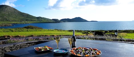 External patio table overlooking ocean