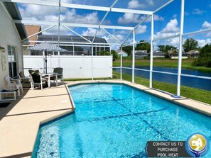 Poolside tranquility with scenic water views, ideal for unwinding and enjoying the sun.