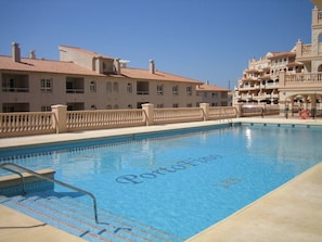 Large swimming pool in full sun.