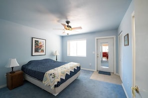 Master bedroom offers privacy as well as access to the back yard. Walk-in closet is an added bonus