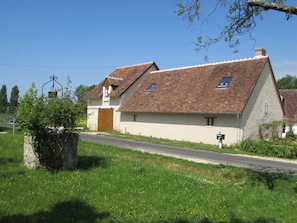 Facade on a quiet rural road that goes across the property