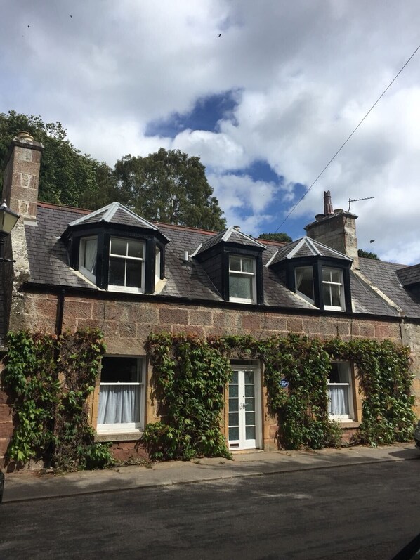 Front of cottage in summer