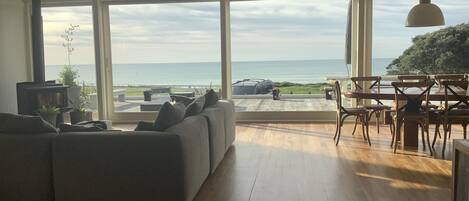 Lounge view across deck and road to beach break 