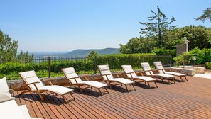 Second sun terrace with luxury loungers and panoramic seaviews