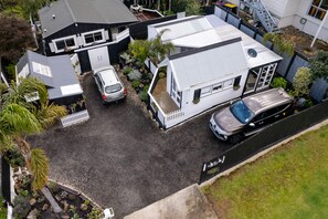 Bathroom, laundry on left, kitchenette and bedroom cottage on right. Parking.
