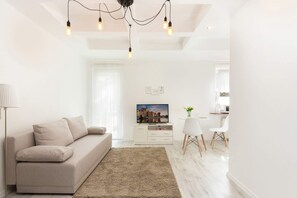 Living room with a comfortable sofa and TV.
