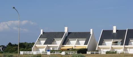 View on house from the street before dune and beach