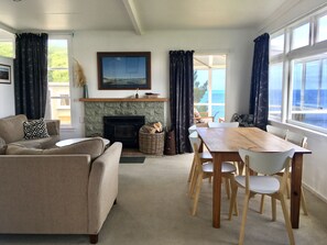 lounge and dining with entrance to sunroom