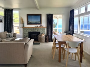 lounge and dining with entrance to sunroom