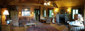 Panoramic photo taken from front door -dining table & window overlook lake