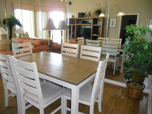 Dining area, mirrored wall reflecting entertainment center