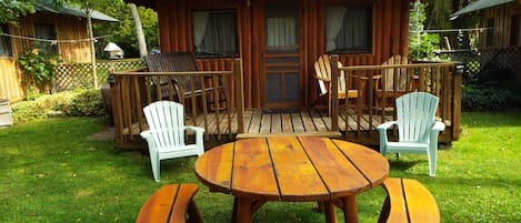 cozy front porch rocker with a beautiful lake view waits for you