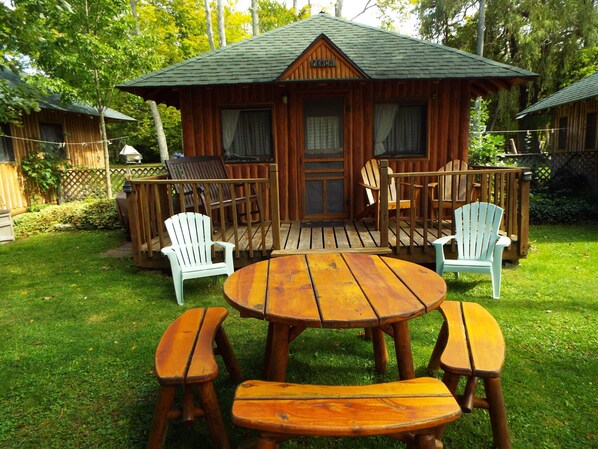 cozy front porch rocker with a beautiful lake view waits for you
