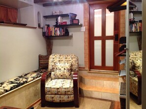 Front Door, Comfortable Chair and Library