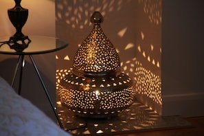 There's a Moroccan lamp in the fireplace.