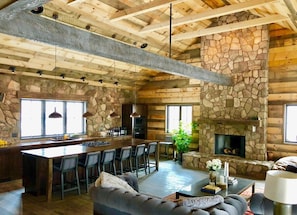 A view of the open floor Great Room and our Restoration Hardware velvet couches and Wickett counter stools.