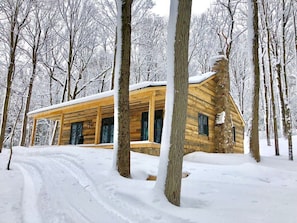 The cabin in the snow.