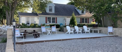 35'x14' cement patio, eco-friendly 8-person table, fire pit, lots of space.