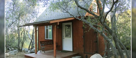 The Playhouse. Off grid tiny house tucked away in the trees.